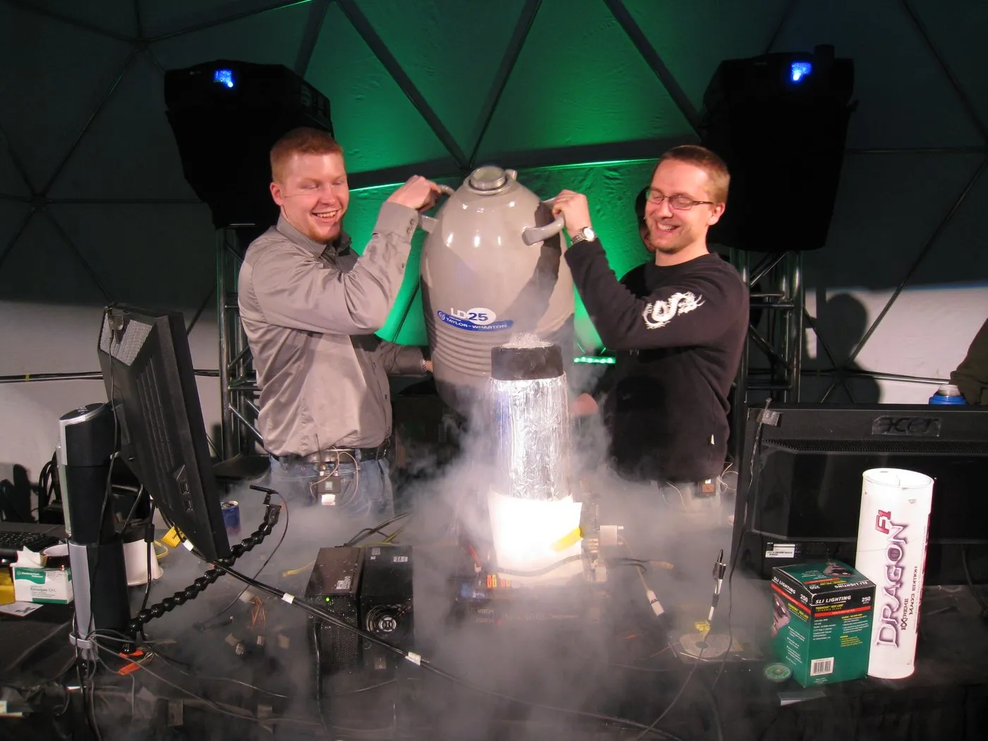 Two SF3D members pouring liquid nitrogen into an open test bench at an event