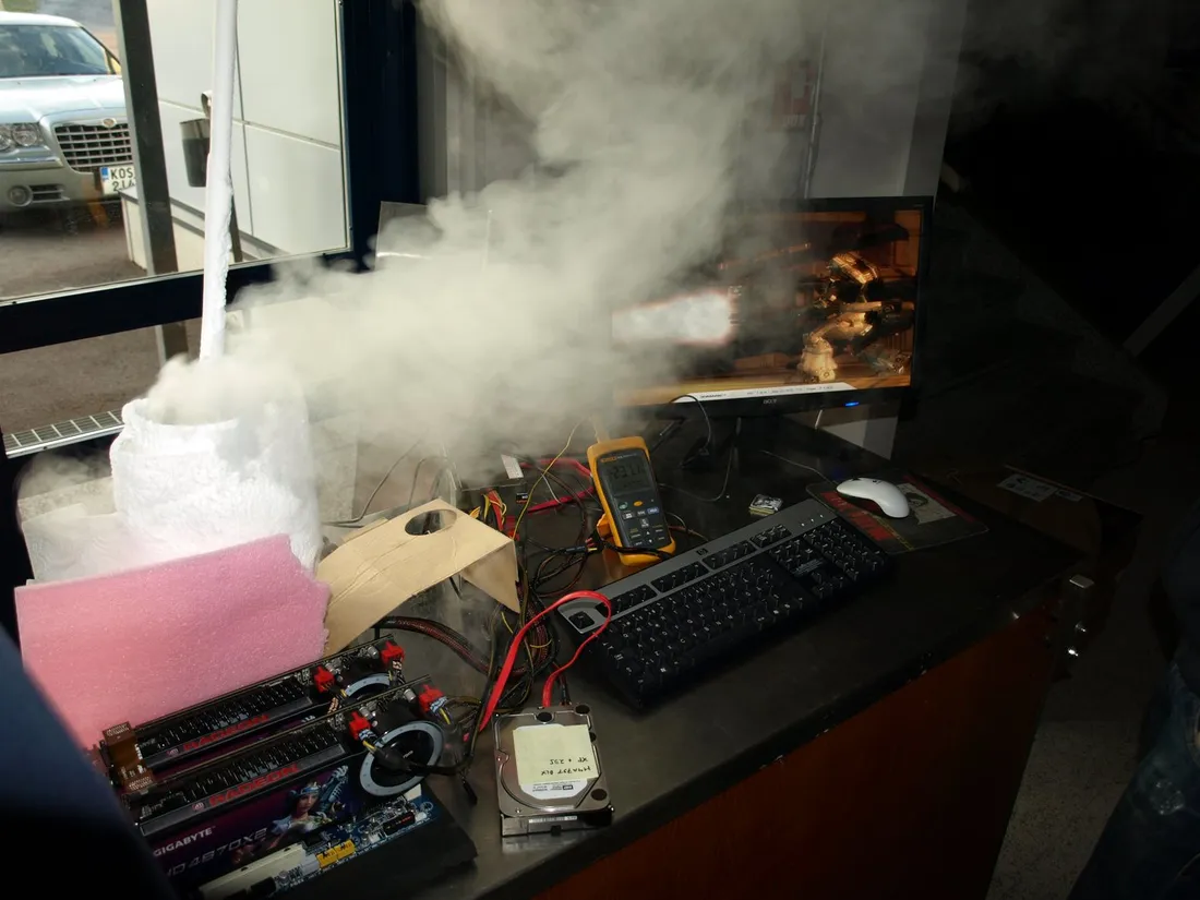 Radeon HD 4870 X2 graphics cards on an open bench amid liquid-nitrogen vapour